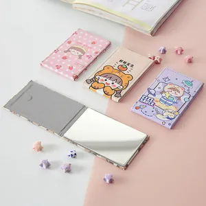 Portable compact folding makeup mirror with cute cartoon designs for travel and vanity