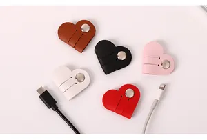 Detailed view of colorful heart-shaped PU leather cable organizers with snap buttons