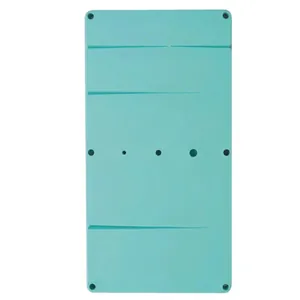 Detailed view of green plastic fondant flower drying board with holes and grooves