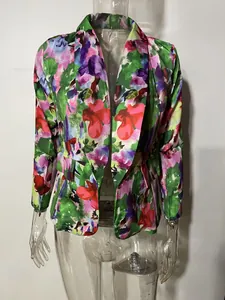 Detailed view of women's floral print blazer jacket with vibrant spring patterns