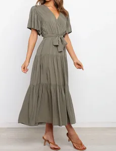 Detail of olive green V-neck bohemian maxi dress with ruffle sleeves and waist tie