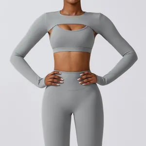 Detailed view of grey yoga set with long sleeve shrug and high-waist fitness leggings