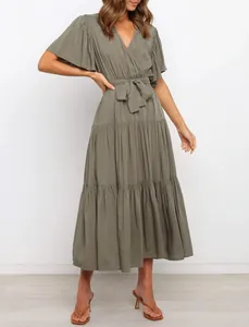Detailed view of women's bohemian V-neck maxi dress in olive green with ruffled sleeves