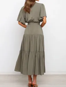 Back view of bohemian olive green maxi dress with ruffle sleeves and tiered skirt