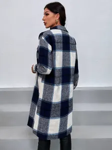 Back view of a long blue and white plaid shacket for women in a casual style