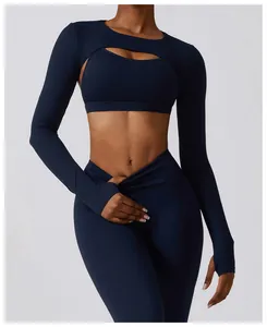 Close-up detail view of navy blue long-sleeve yoga shrug and matching sports bra set