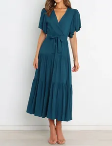 Detail of a teal V-neck Bohemian maxi dress with ruffle short sleeves and a belted waist.