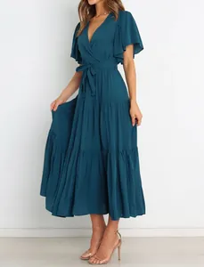 Elegant dark teal V-neck bohemian maxi dress with tiered skirt and flutter sleeves