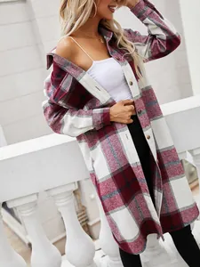 Stylish red and white plaid longline shirt jacket for women in casual outdoor setting