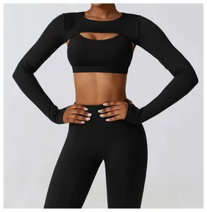 Close-up view of black long-sleeve shrug and sports bra yoga set
