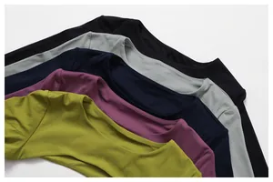 Macro view of multi-color long sleeve yoga shrugs featuring smooth naked-feel fabric