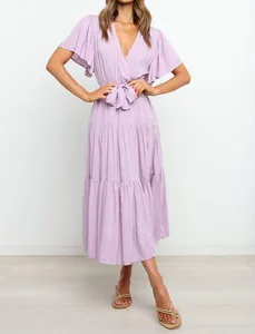 Detail view of a lavender V-neck midi dress with ruffle sleeves and a tied waist belt.