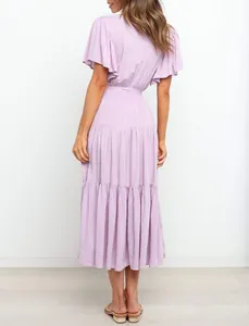 Back view of a lavender bohemian maxi dress with ruffle sleeves and tiered skirt