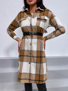 Detail view of stylish brown plaid longline shirt jacket with lapel and button-down front