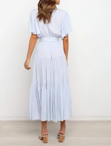 Rear view of light blue Bohemian maxi dress with ruffled sleeves and tiered skirt
