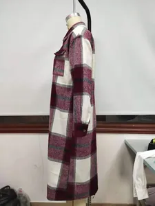 Side profile view of a long-sleeved burgundy and white checkered shirt jacket for women