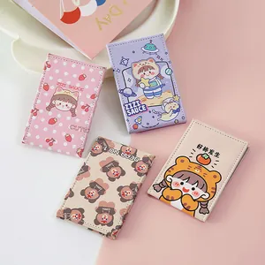 Set of four cute cartoon portable folding makeup mirrors in pastel colors