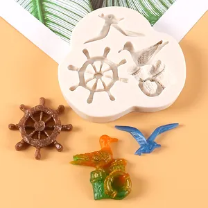 Nautical themed silicone mold featuring ship wheel and seagull for fondant cake decorating