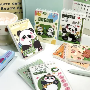 Cute A7 spiral notebooks featuring colorful panda illustrations and pastel covers on a desk