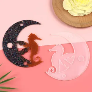 Detailed macro view of a semi-3D moon and seahorse silicone mold with resin sample