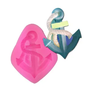Detailed view of nautical ship anchor silicone mold showing the mold and finished fondant