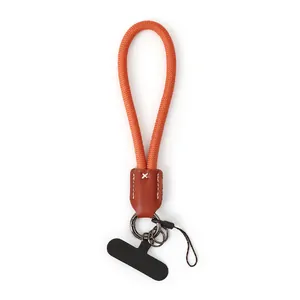 Orange nylon rope phone wrist strap with brown leather connector and tether tab