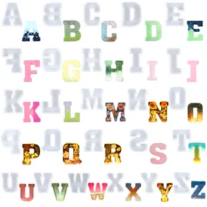 Complete 26 English alphabet silicone molds for DIY resin art with colorful resin samples.