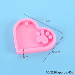 Pink heart-shaped cat paw silicone mold with dimensions for DIY keychains and baking fondant