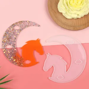 Detailed view of moon horse head silicone resin mold with finished orange glitter piece