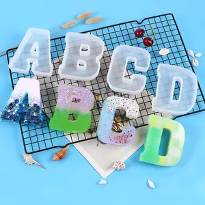 Translucent silicone letter molds for DIY resin craft with colorful finished samples