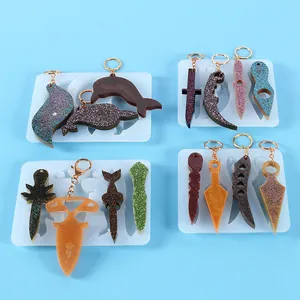 Detail view of various DIY silicone molds for resin knuckle dusters and keychains