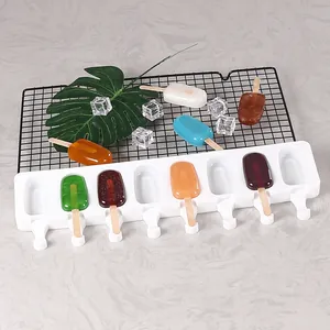 Detailed view of an 8-cavity white silicone popsicle mold with colorful DIY ice pops