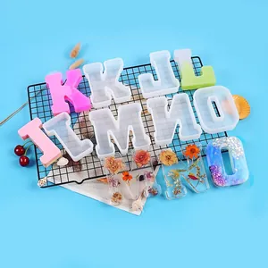 Various 3D alphabet silicone molds for resin casting with finished decorative floral samples