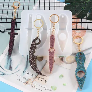 Detailed view of translucent silicone mold for DIY resin daggers and glittery finished keychains