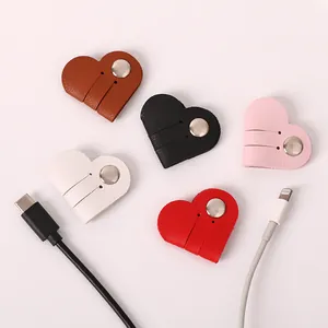 Heart-shaped PU leather cable organizers with snap buttons shown in five vibrant colors