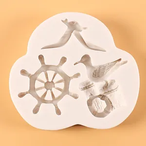 Detailed macro view of nautical silicone mold featuring seagull and ship wheel designs.