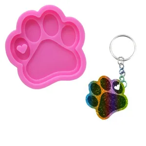Paw print silicone mold with heart detail and rainbow glitter resin keychain