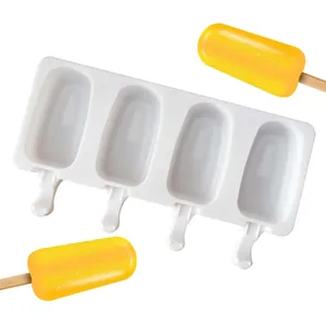 Detail showing 4-cavity silicone popsicle mold and vibrant orange frozen ice treats on sticks.