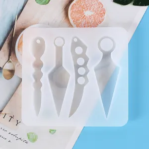 Detail of silicone mold with knuckle duster and kunai shapes for DIY resin art crafts