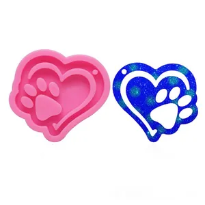 Silicone heart paw print mold for DIY resin keychains and pendants with blue glitter sample