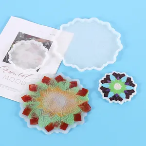 Detailed view of mandala pattern silicone coaster molds and finished resin crafts.