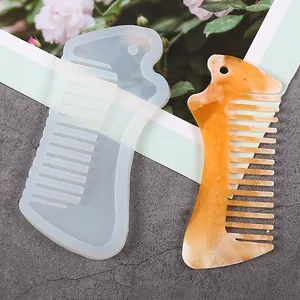 Detailed view of a DIY crystal epoxy comb silicone mold shown with a finished resin comb