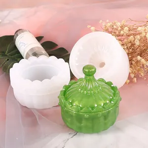 Close-up of DIY silicone pumpkin storage box mold with finished green resin jar detail