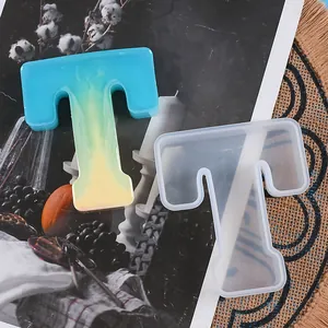 Detailed view of the letter T silicone mold with a finished gradient resin craft piece