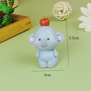 Macro detail view of a cute blue resin elephant cake topper decoration, size 5.5x4cm