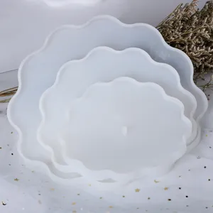 Detailed view of three sizes of stacked wavy silicone molds for DIY resin fruit tray