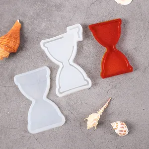 Detail view of hourglass shaped silicone molds for resin casting and DIY keychain making