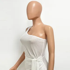 Close-up of white sequin one-shoulder evening dress with ruched waist and tie detail