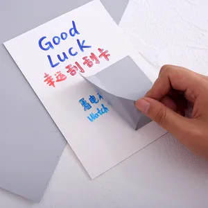Silver DIY scratch-off sticker being peeled to reveal handwritten prize content