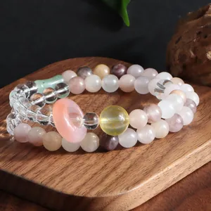 Macro view of double-strand crystal bracelet with amethyst, citrine and rose quartz beads